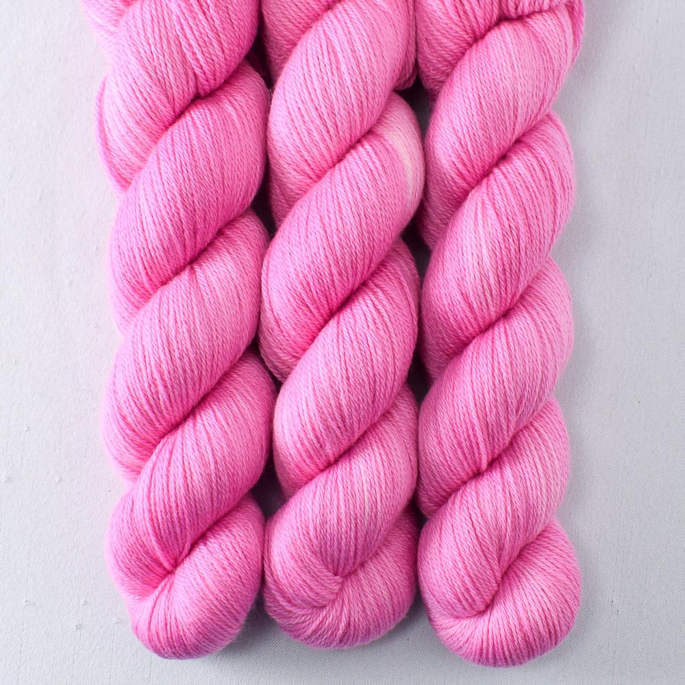 Neon Pink worsted wool hand dyed 3 ply soft wool yarn from our