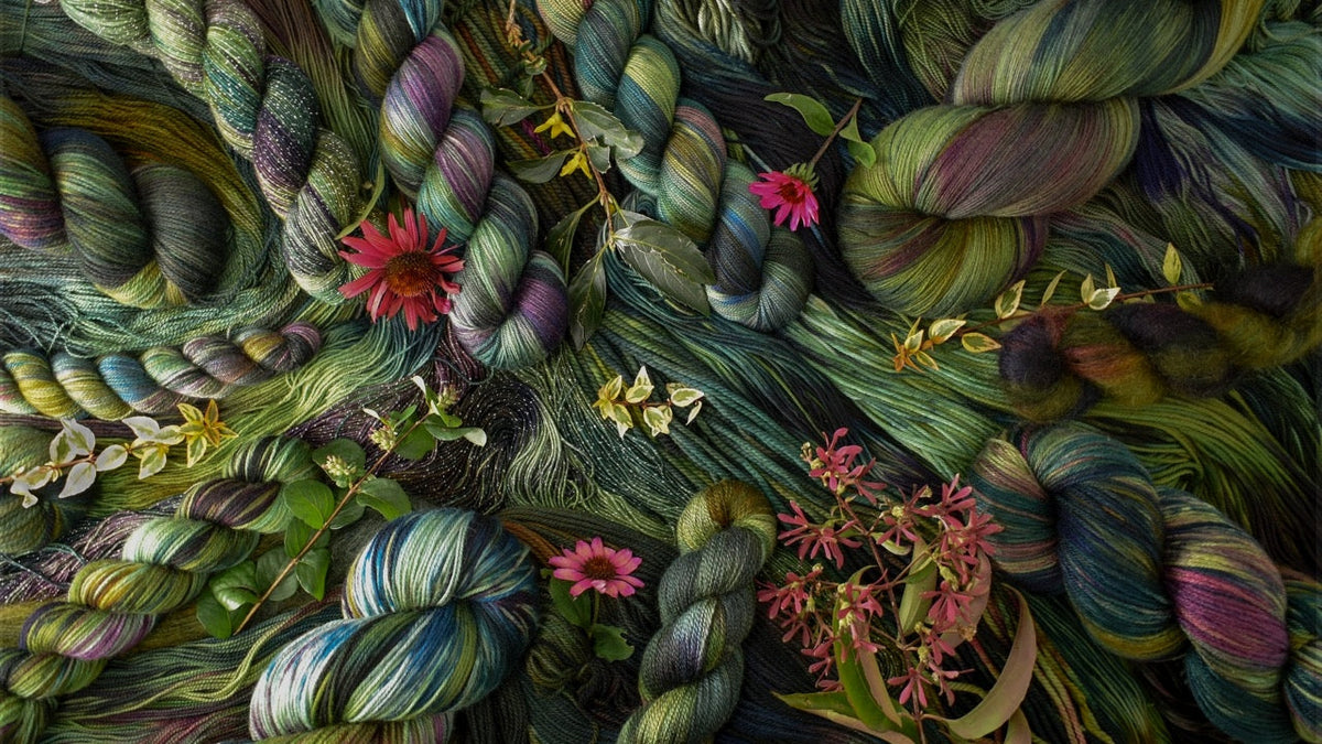 Variegated green yarn with scattered leaves and flowers